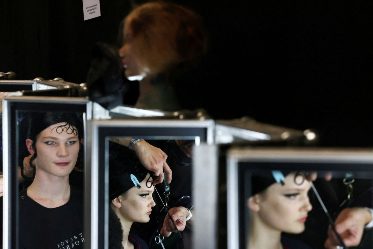 Models prepare backstage during <a href="https://www.cnn.com/style/article/london-fashion-week-highlights-spring-summer-2022/index.html" target="_blank">London Fashion Week</a> on Saturday, February 19.