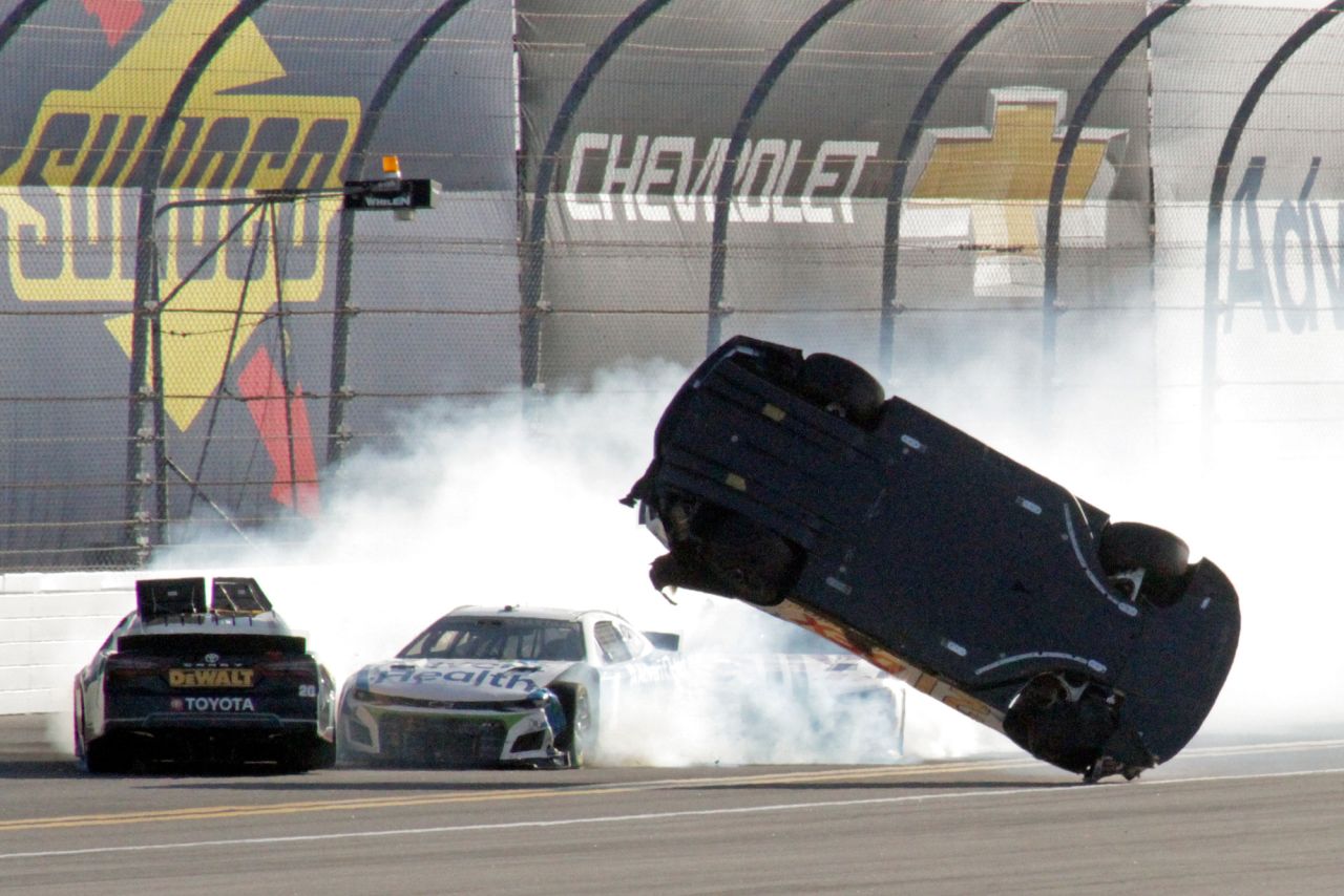 Harrison Burton flips as he wrecks on the backstretch as Christopher Bell, left, and Ross Chastain try but are unable to avoid the crash during the <a href="https://www.cnn.com/2022/02/20/us/daytona-500-winner-2022/index.html" target="_blank">NASCAR Daytona 500</a> on Sunday, February 20.