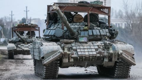 Russian tanks move across the town of Armyansk in northern Crimea. 