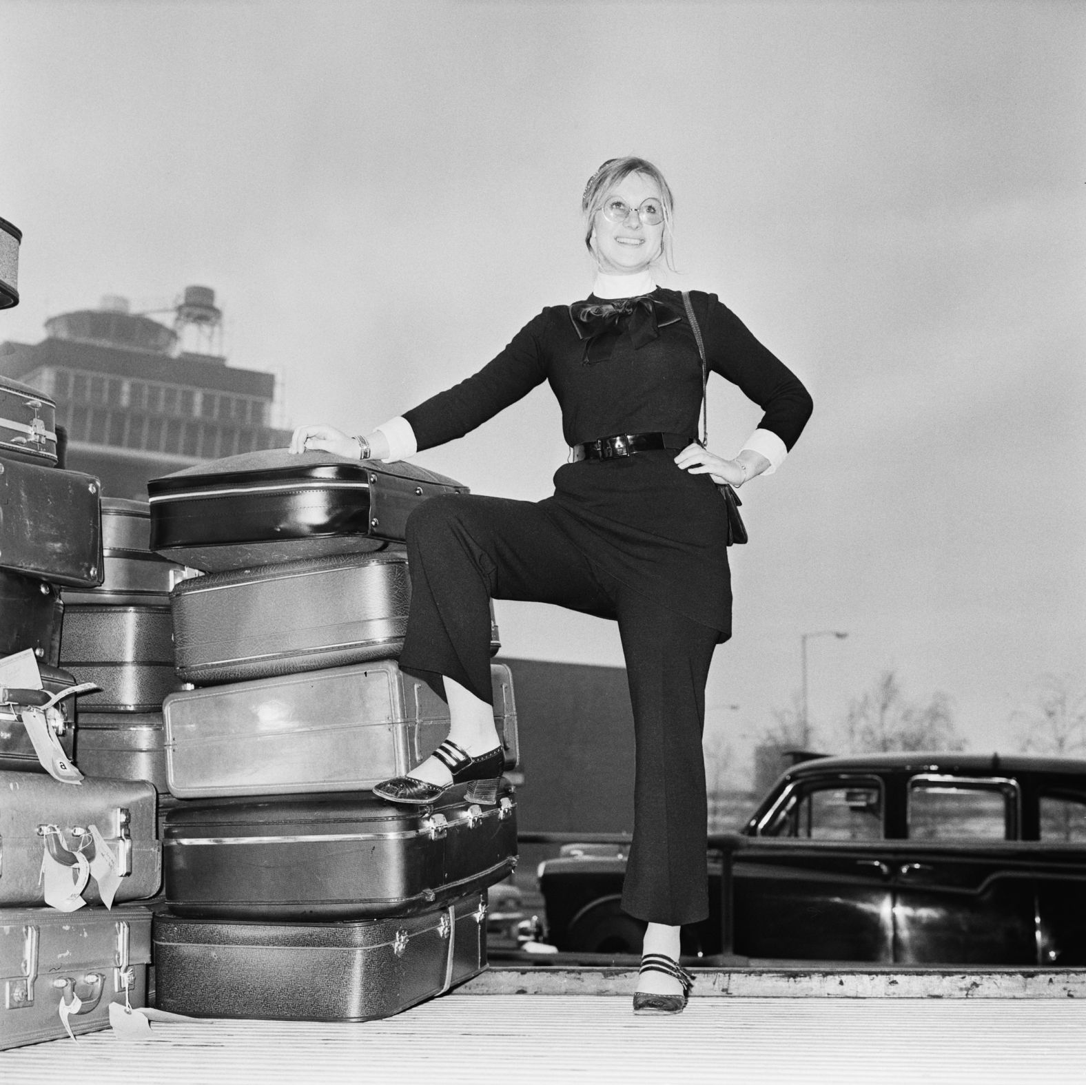 Mirren waits with her luggage at the London Airport in 1969.