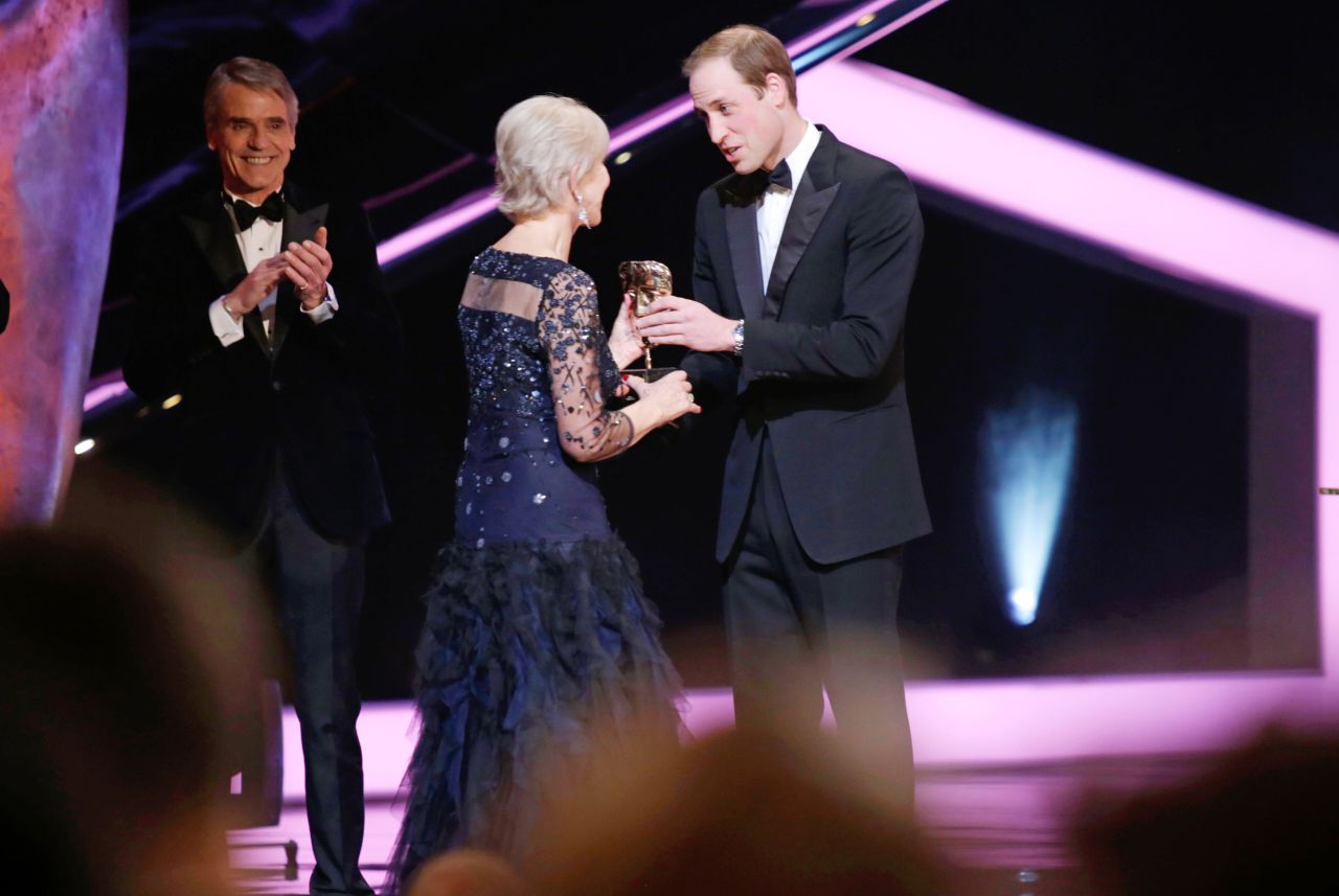 Prince William presents Mirren a BAFTA fellowship during the 2014 British Academy Film Awards.