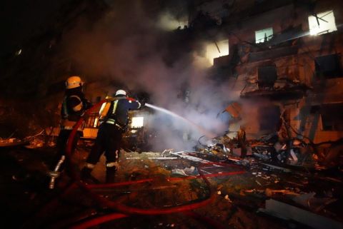 In this handout photo from the Ukrainian government, firefighters respond to the scene of a residential building on fire in Kyiv on February 25. Anton Gerashchenko, adviser to the Head of the Ministry of Internal Affairs of Ukraine, said the city had been hit by <a href=