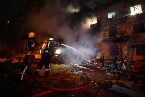 In this handout photo from the Ukrainian government, firefighters respond to the scene of a residential building on fire in Kyiv on February 25. Anton Gerashchenko, adviser to the Head of the Ministry of Internal Affairs of Ukraine, said the city had been hit by <a href=