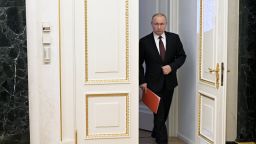 nato article 5 summary Russian President Vladimir Putin arrives to chair a Security Council meeting via a video link in Moscow on February 25, 2022.