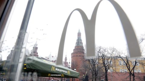 People walk outside a McDonald's restaurant on Manezhnaya Square in Moscow Russia in April 2014.