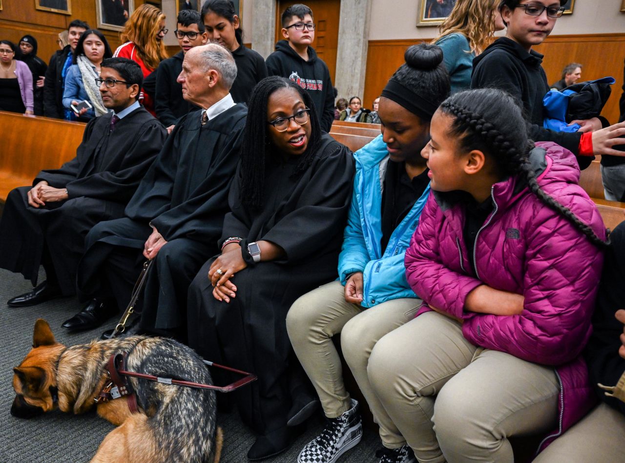 Jackson, center, talks with local high school students who have come to observe a reenactment of a landmark Supreme Court in 2019. Also on the bench with her are Srinivasan, far left, and Tatel.