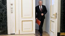 Russian President Vladimir Putin enters a hall before a meeting with members of the Security Council via a video link in Moscow, Russia February 25, 2022. Sputnik/Alexey Nikolsky/Kremlin via REUTERS ATTENTION EDITORS - THIS IMAGE WAS PROVIDED BY A THIRD PARTY.