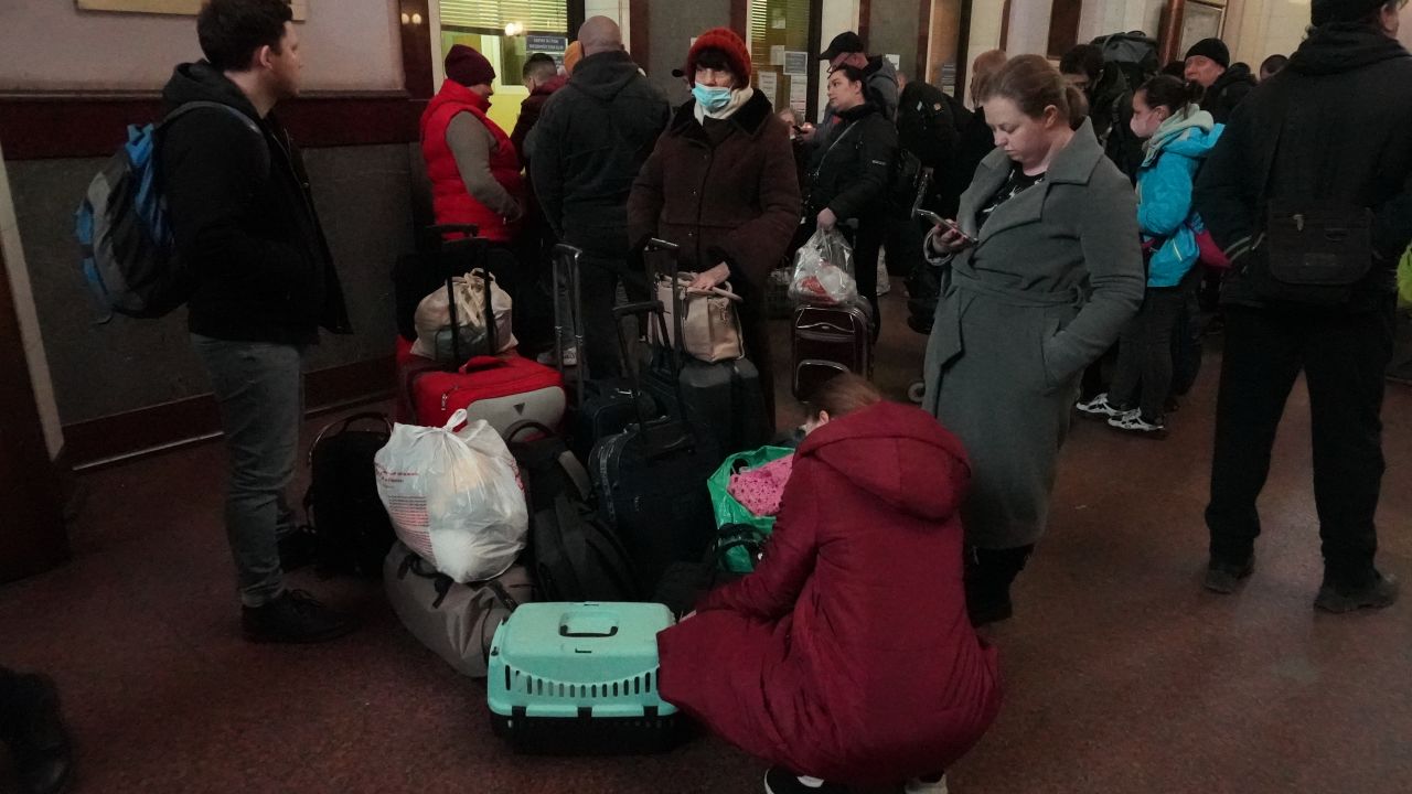 People search through belongings and plan where to go next.