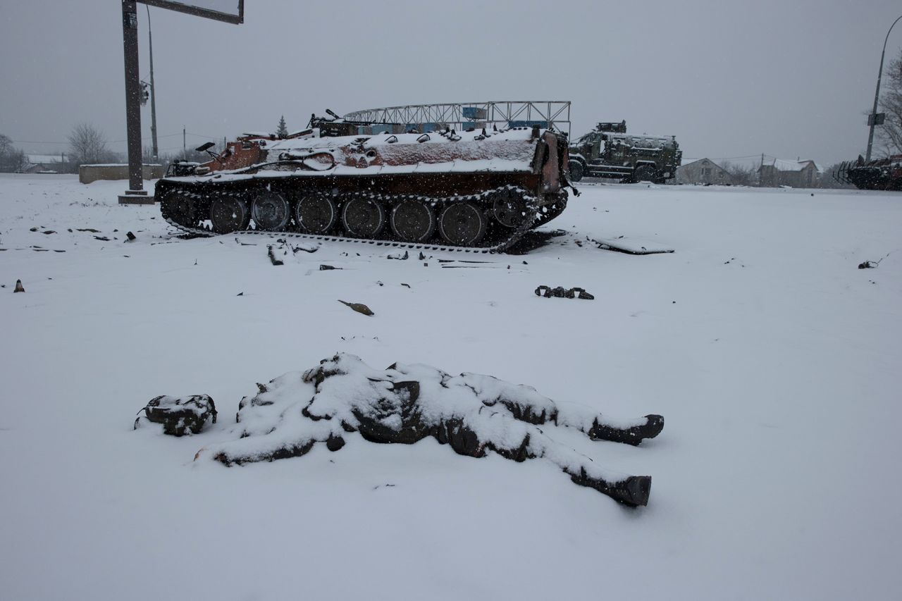 The body of a Russian soldier lies next to a Russian vehicle outside Kharkiv on February 25.