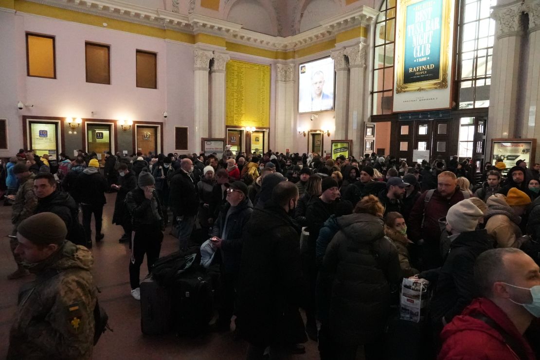 Crowds of displaced people disembark at Lviv station.