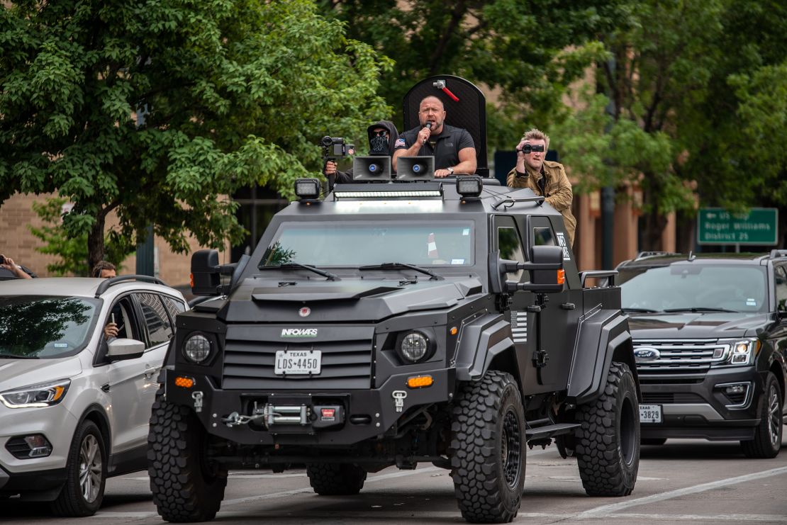 Alex Jones and other protesters took to the streets in Austin, Texas, to call for the country to open up despite the pandemic in April 2020.  