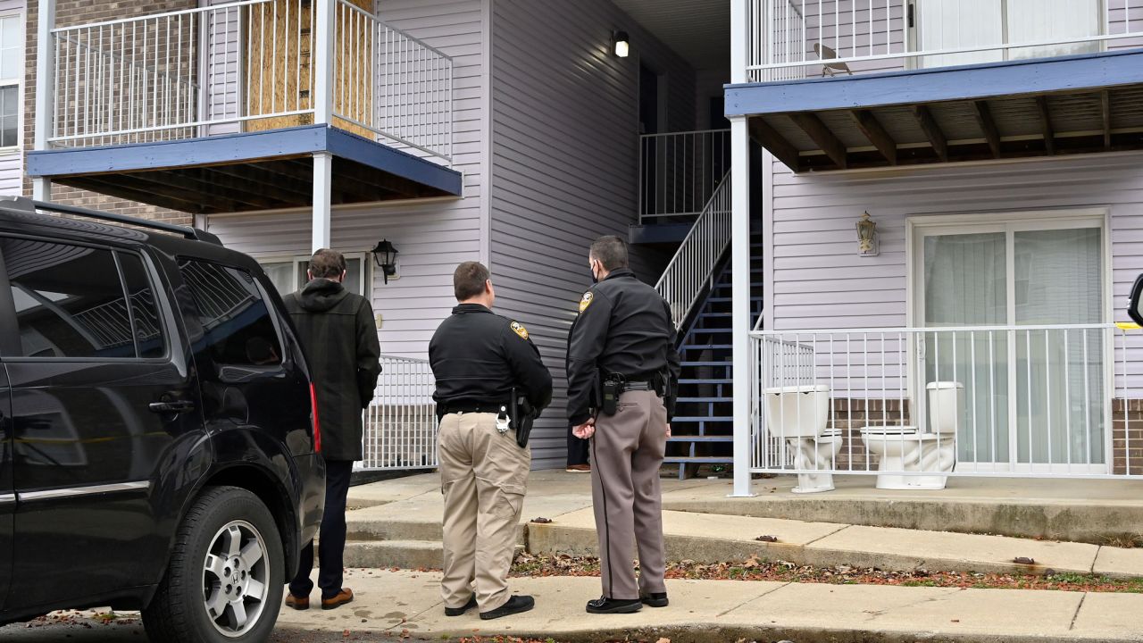Authorities stand guard as jurors are given a walk-through of Breonna Taylor's apartment in Louisville on February 25, 2022.