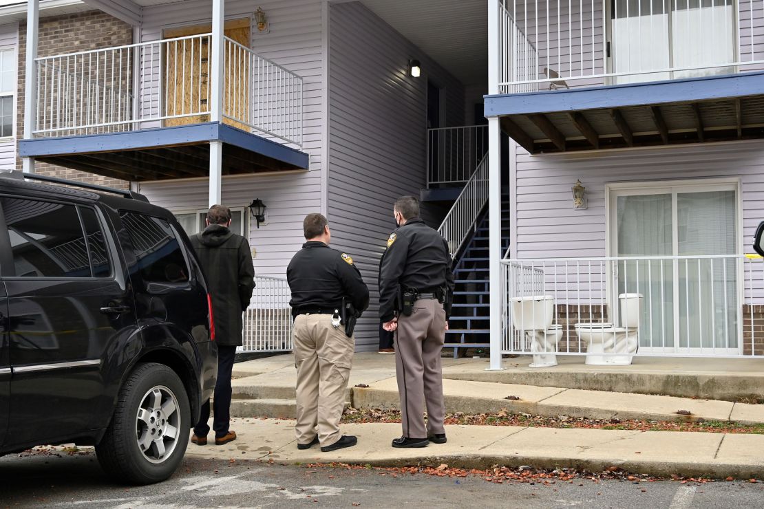 The visiting players walk by the door on the way to their batting