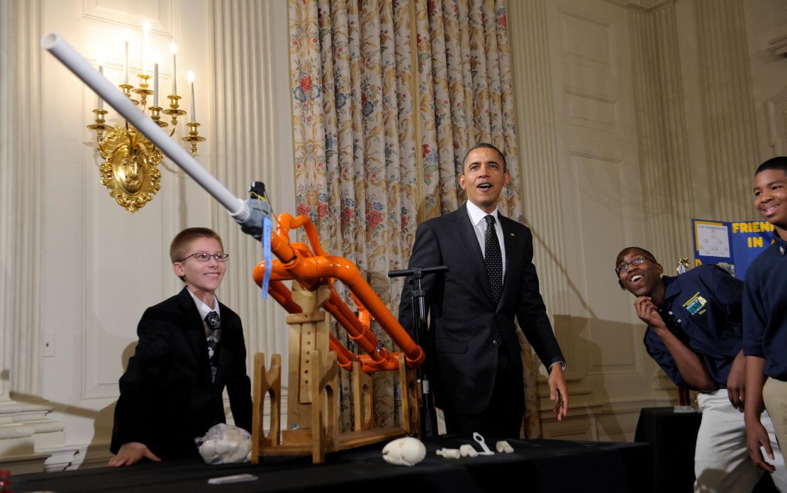 President Barack Obama reacts after watching a marshmallow be launched in a gun designed by Joey Hudy, left, of Phoenix, Arizona, left, at the White House in February 2012. 