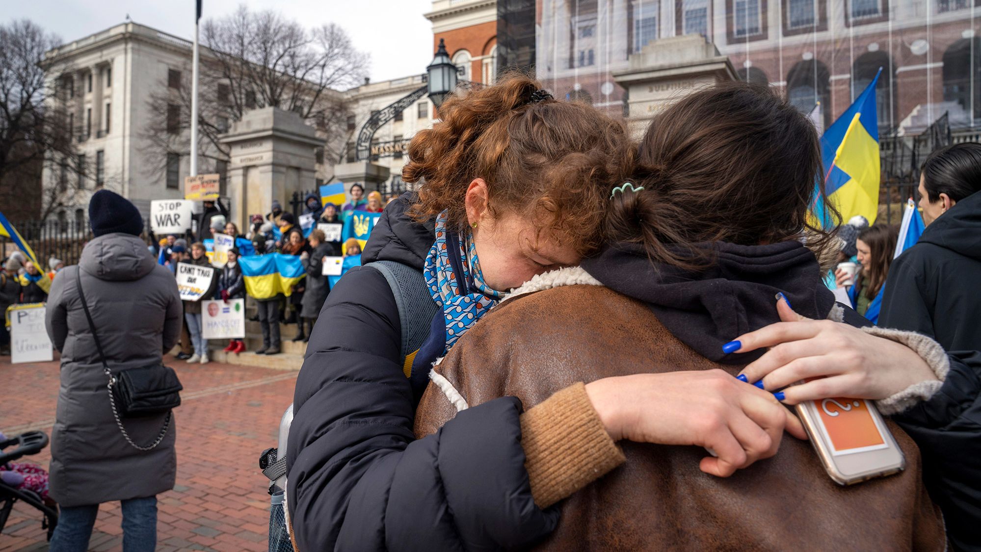 Protesters gather outside the Massachusetts State House in Boston on February 24.