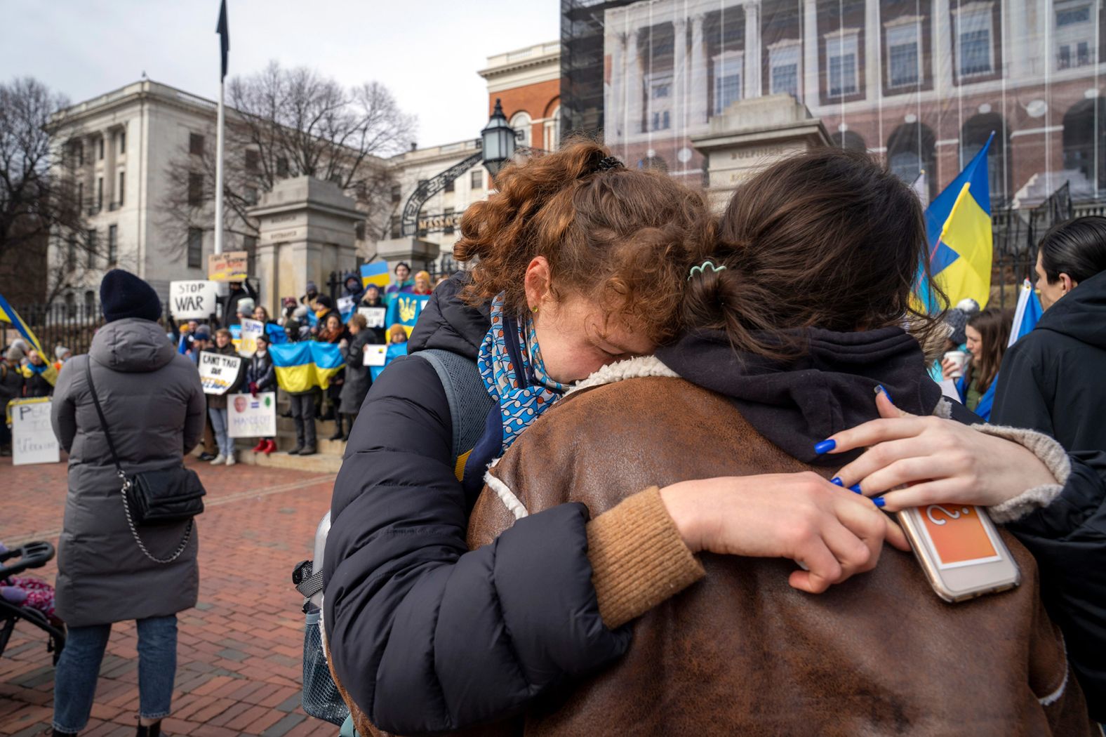 Protesters gather outside the Massachusetts State House in Boston on February 24.