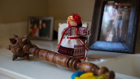 Ukrainian mementos in Alex Podebryi's home include a bulava club and a handmade motanka doll.