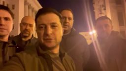 "We are here. We are in Kyiv. We are defending Ukraine."That was the title of a video posted on Facebook Friday night by Ukrainian President Volodymyr Zelensky, as he vowed to defend his country while standing on a Kyiv street with other leaders of his administration.
