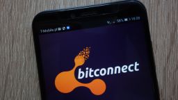  The BitConnect logo is displayed on a smartphone.
