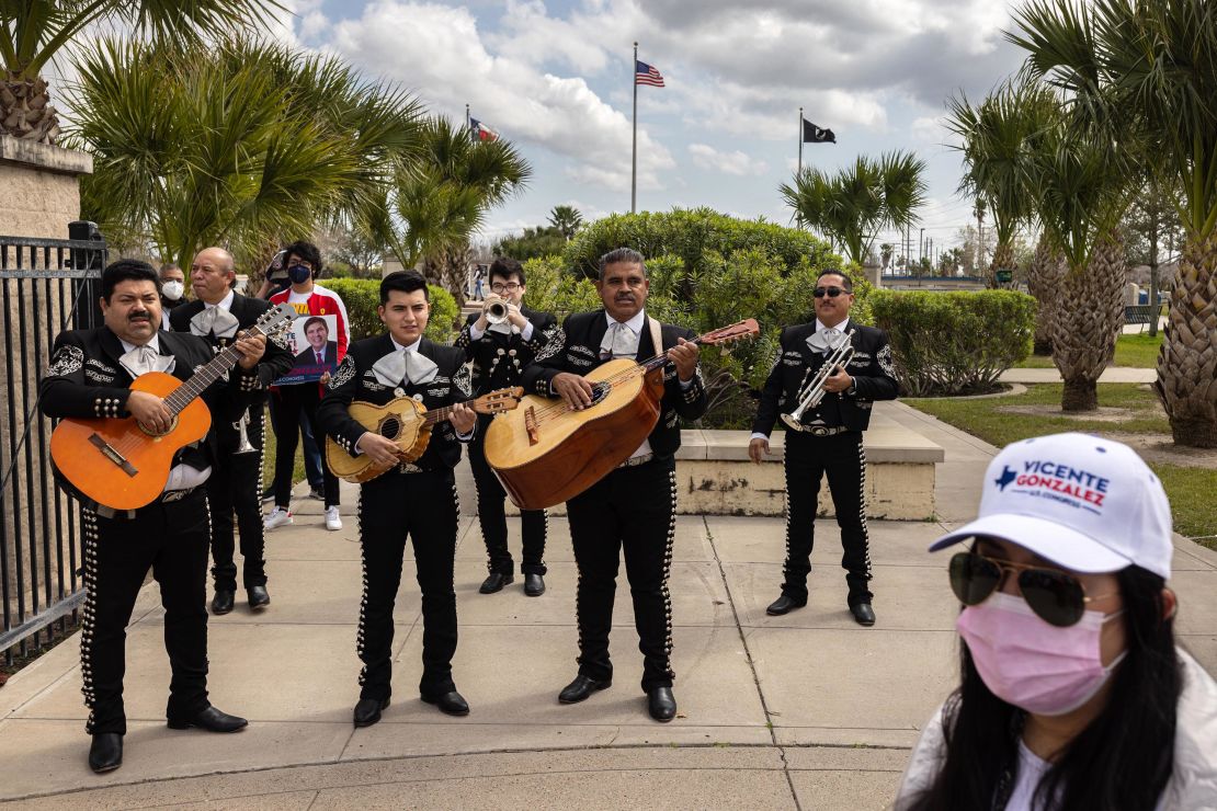 A mariachi band performs amid supporters of local Democratic candidates, including Rep. Vicente Gonzalez, outside the Brownsville Public Library polling location during early voting for the 2022 primary.