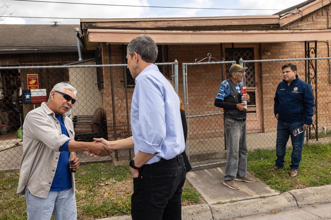 Former Rep. Beto O'Rourke (center left), now running for governor, and Rep. Vicente Gonzalez (right) speak with Robert Lopez (far left) and James Roussett while canvassing a neighborhood in Brownsville.