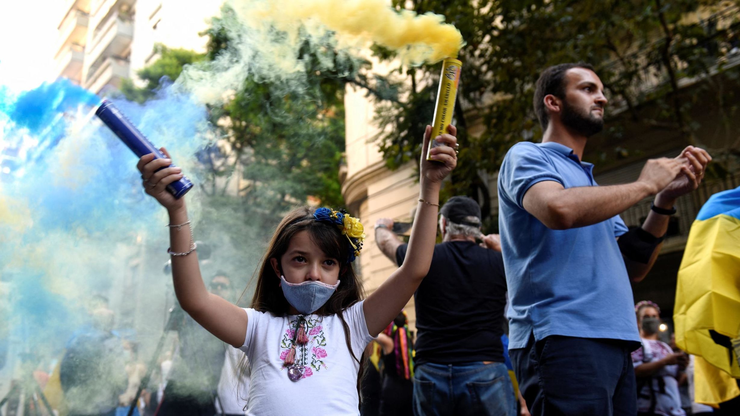A child holds smoke bombs at a protest in Buenos Aires on February 25.