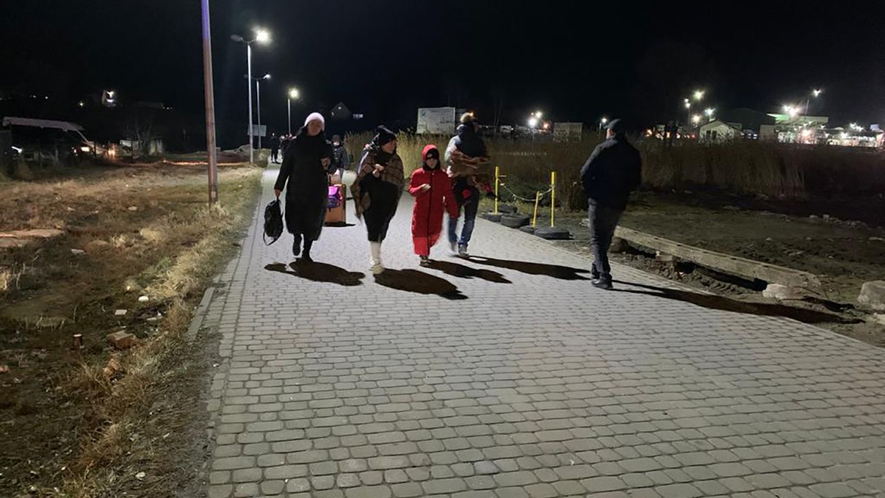 Ukrainian refugees crossing the border into Medyka, Poland.