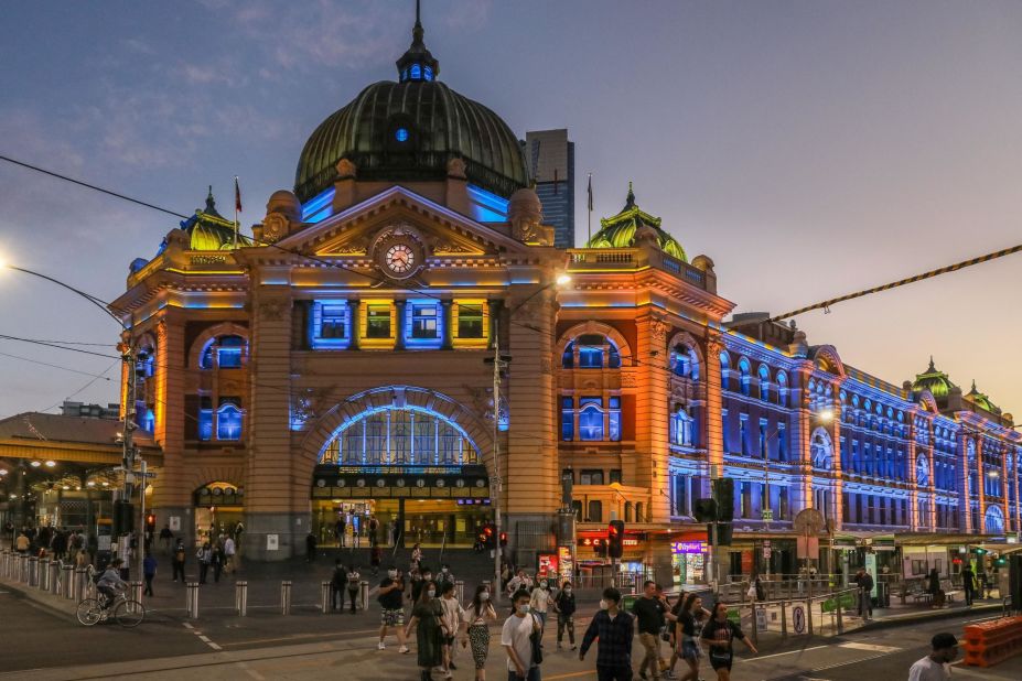 Flinders Street Station in Melbourne is lit in yellow and blue on February 24 as public buildings were lit up in the national colors of Ukraine.