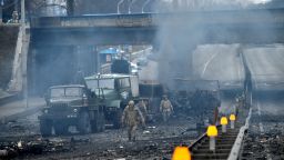 Ukrainian service members are seen at the site of fighting with a Russian raiding group in Kyiv on the morning of February 26, 2022, according to Ukrainian service personnel at the scene.