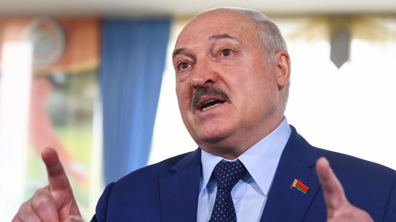Belarusian President Alexander Lukashenko talks to reporters at a polling station after casting his vote in the 2022 Belarusian constitutional referendum in Minsk, Belarus, on February 27, 2022.