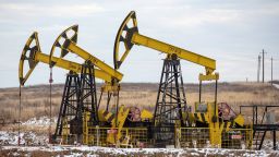 Oil pumping jacks in a Rosneft oilfield near Sokolovka village, Russia. 