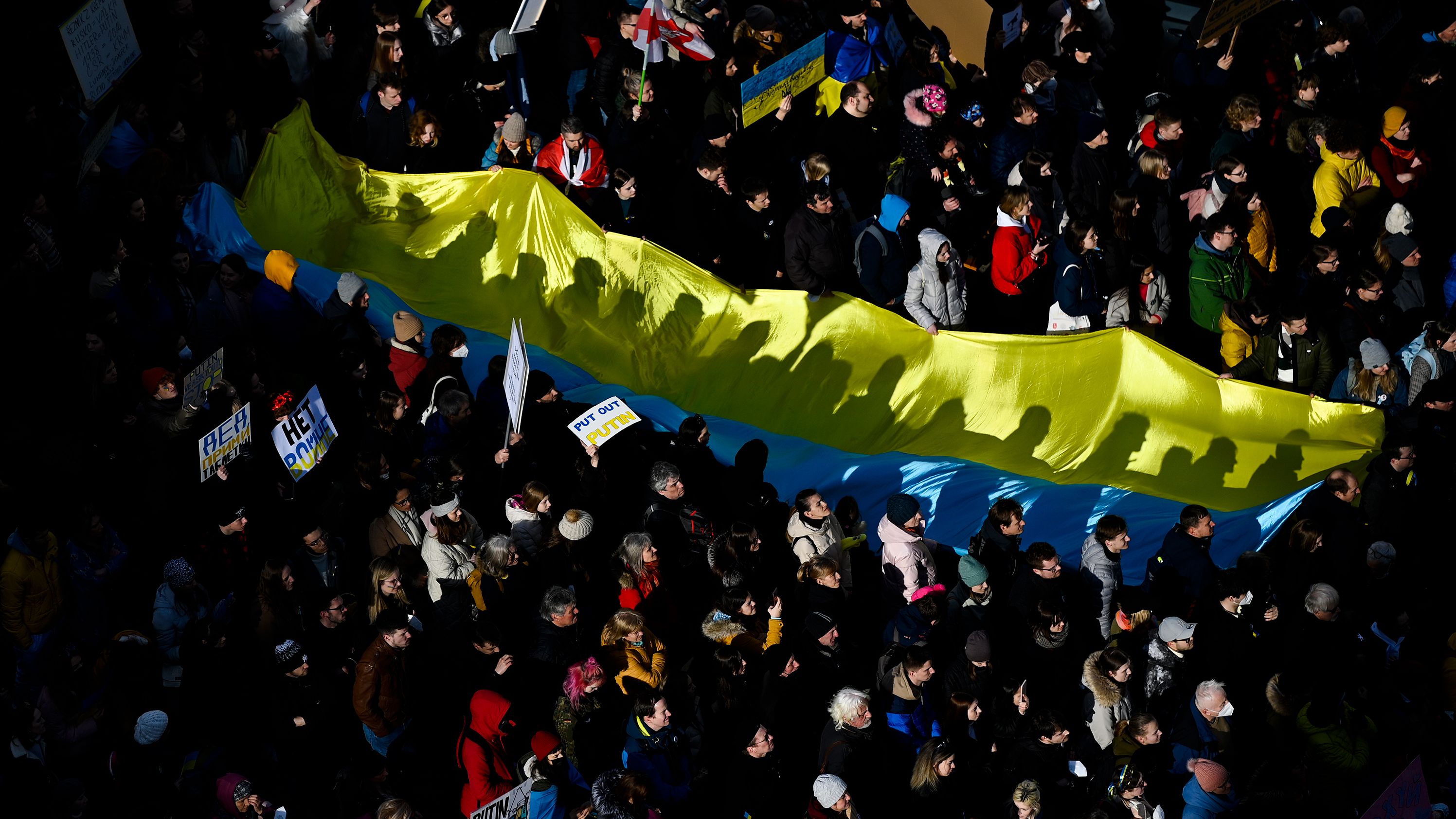 People gather for a demonstration in Prague, Czech Republic, on February 27. <a href="https://www.cnn.com/europe/live-news/ukraine-russia-news-02-27-22/h_6fdd49696f27d7f495309869ff0fac3a" target="_blank">The event in Prague</a> was particularly poignant given that many of its attendees experienced a Russian invasion firsthand. In 1968, Soviet-led armies of the Warsaw Pact invaded Czechoslovakia, crushing the so-called Prague Spring democratic reform movement and restoring the totalitarian communist regime. The troops stayed in Czechoslovakia for over two decades, with the last leaving in 1991.