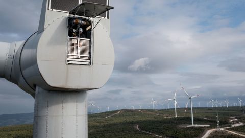 Employees from Akfen Renewable Energy Group's Canakkale Wind Power Plant in Turkey do a routine maintenance check of equipment on the top of a wind turbine in December 2021.