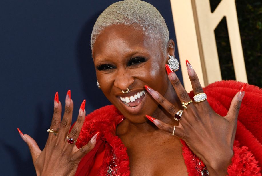 Cynthia Erivo, who plays singer Aretha Franklin in the "Genius" television series, shows off her nails on the silver carpet.