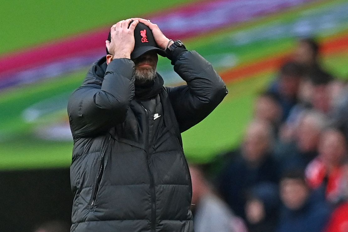 Klopp holds his head as he reacts to his side's goal being ruled out for offside in the Carabao Cup final. 