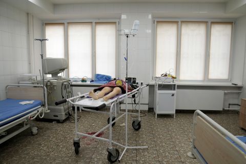 The lifeless body of a 6-year-old girl, who according to the Associated Press was killed by Russian shelling in a residential area, lies on a medical cart at a hospital in Mariupol on February 27. The girl, whose name was not immediately known, was rushed to the hospital but could not be saved.