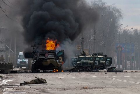 A Russian armored vehicle burns after fighting in Kharkiv, Ukraine, on February 27. Street fighting broke out as Russian troops entered Kharkiv, Ukraine's second-largest city, and residents were urged to stay in shelters and not travel.