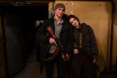 Newly married couple Yaryna Arieva and Sviatoslav Fursin pose for photo in Kyiv on February 25 after they joined the Territorial Defense Forces.