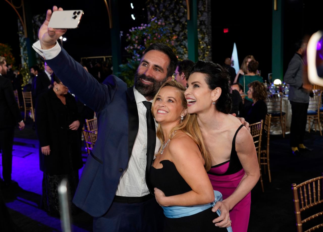 Néstor Carbonell takes a selfie with "The Morning Show" co-stars Reese Witherspoon, center, and Julianna Margulies.