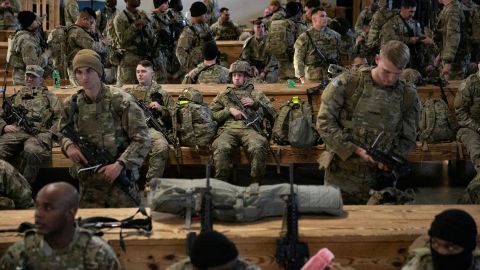 Soldiers of the 82nd Airborne Division wait in Fort Bragg, North Carolina, before deploying to Europe on February 14.