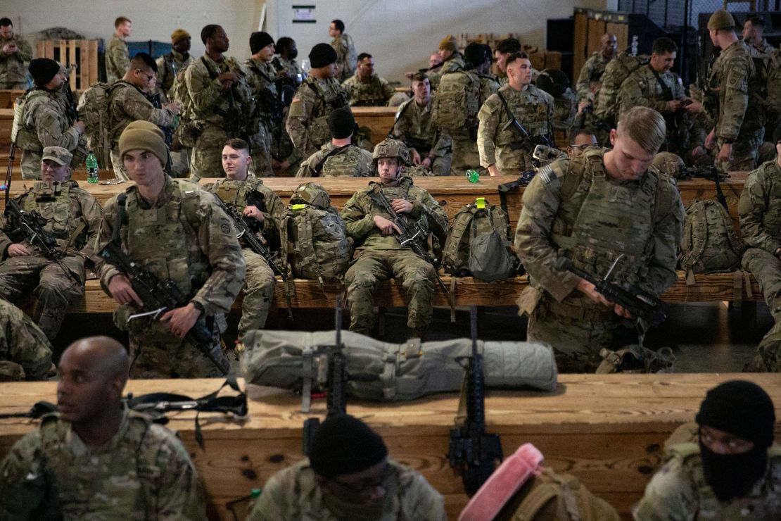 Soldiers of the 82nd Airborne Division wait in Fort Bragg, North Carolina, before deploying to Europe on February 14.