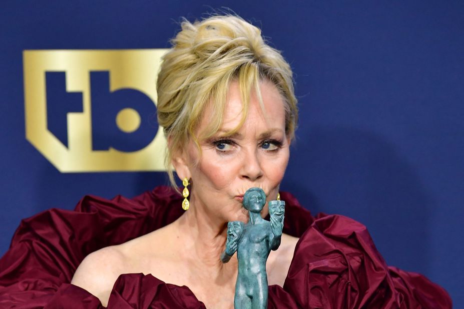 Jean Smart, inside the show's press room, kisses the award she won for outstanding performance by a female actor in a comedy series. The "Hacks" star also was nominated for her role in the miniseries "Mare of Easttown."