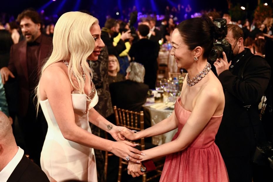 Actress and singer Lady Gaga, left, talks with "Squid Game" actress Kim Joo-ryoung during the show. Gaga was nominated for her role in the film "House of Gucci."