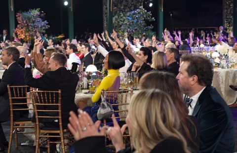 The audience does the sign for "I love you" to the cast of "CODA" after it won the SAG award for outstanding performance by a cast in a motion picture. The film is about a teenager raised by deaf parents; "CODA" stands for child of deaf adults.