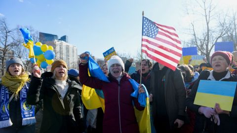 Demonstrators protest against Russia's invasion in front of the State House on Sunday in Boston.