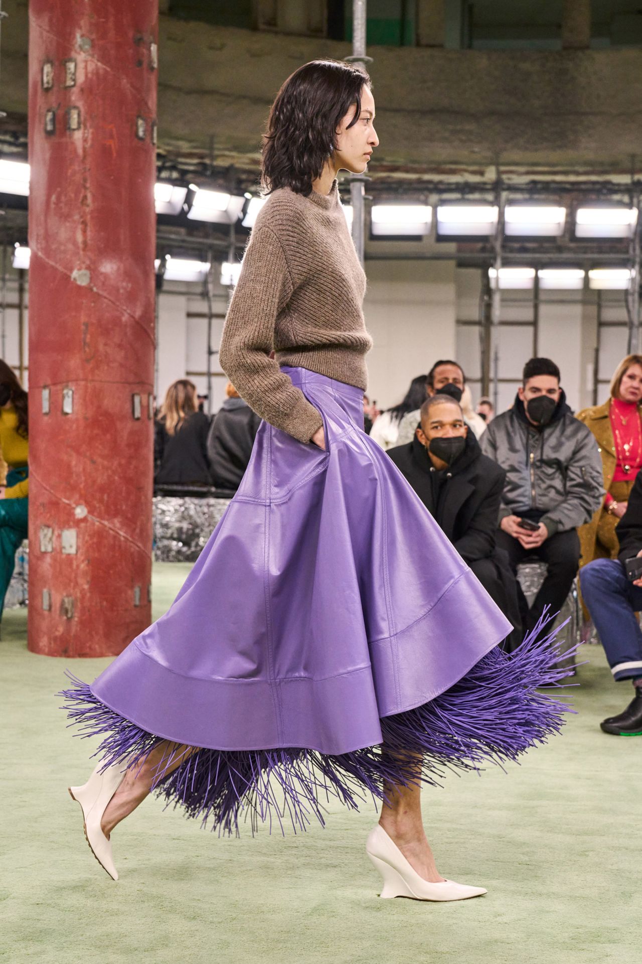 Leather round skirts in purple, butter yellow and bone white were layered with fringes. 