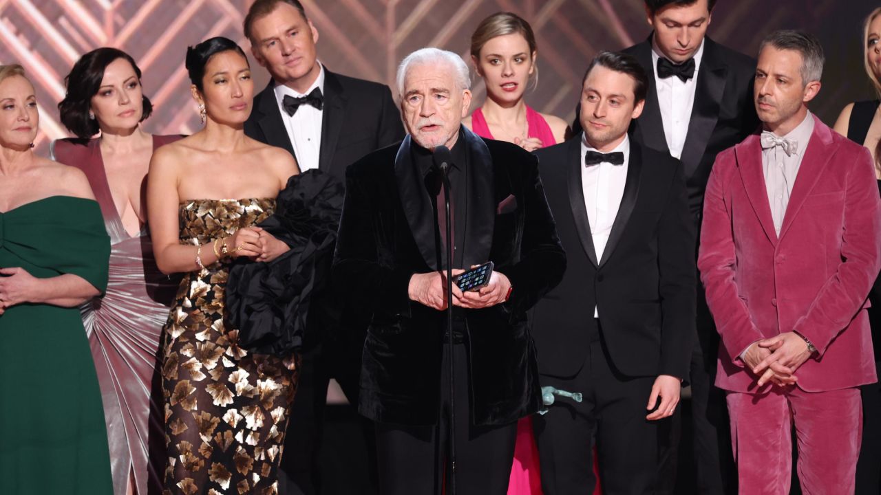 J. Smith-Cameron, Dagmara Dominczyk, Jihae, Scott Nicholson, Dasha Nekrasova, Brian Cox, Kieran Culkin, Nicholas Braun, Jeremy Strong and Justine Lupe accept the award for Outstanding Performance by an Ensemble in a Drama Series for 'Succession' onstage during the 28th Annual Screen Actors Guild Awards at Barker Hangar on February 27, 2022 in Santa Monica, California.