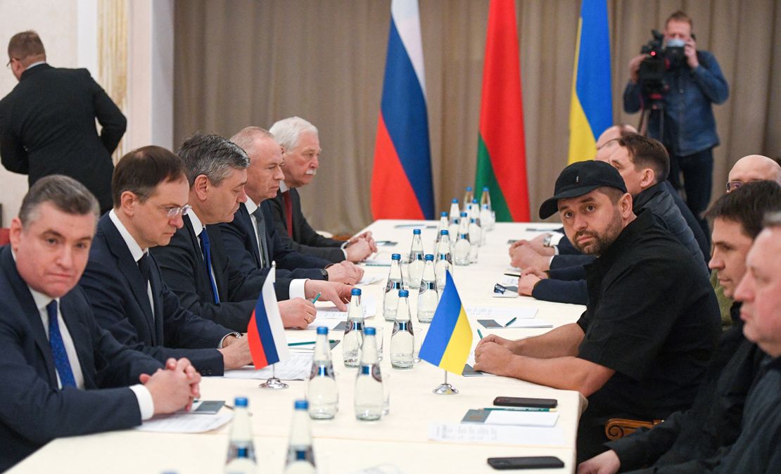Russian officals, left, and Ukrainian officials, right, during talks on February 27 in the Gomel region of Belarus.