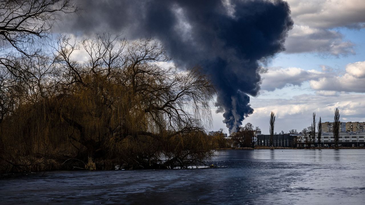 Smoke billows over the town of Vasylkiv just outside Kyiv on February 27, 2022, after overnight Russian strikes hit an oil depot.