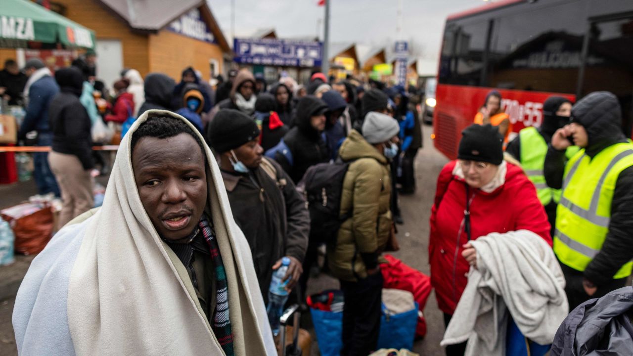 People fleeing the violence in Ukraine are seen at the Medyka pedestrian border crossing in eastern Poland on February 27, 2022. 